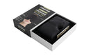 Black Thermax head comfort cap folded beside its packaging